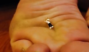 Giantess Mother Caroline Takes Off Shoes and Puts Her Stinky Feet Up To Tiny